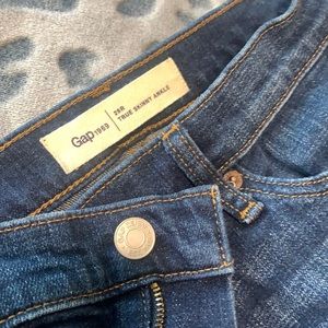 Stretch Denim, Button-Closure, Zip Fly, and Medium Indigo Wash.